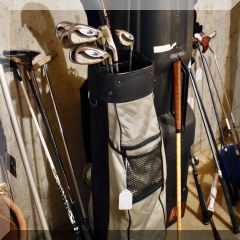 L11. Black golf bag and clubs - $30